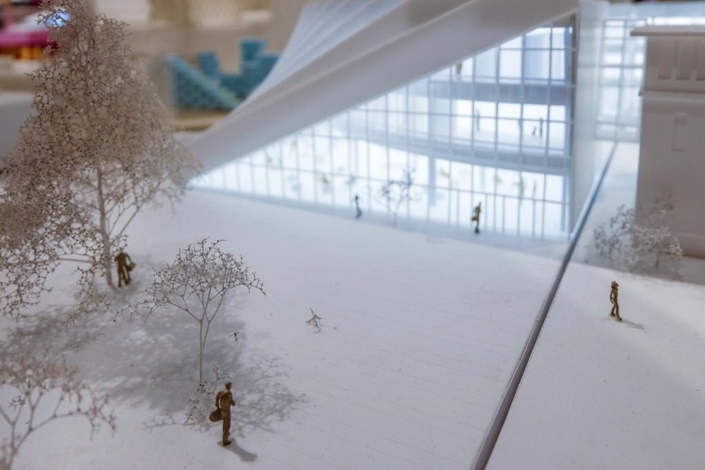White architectural scale model with miniature trees and human figures