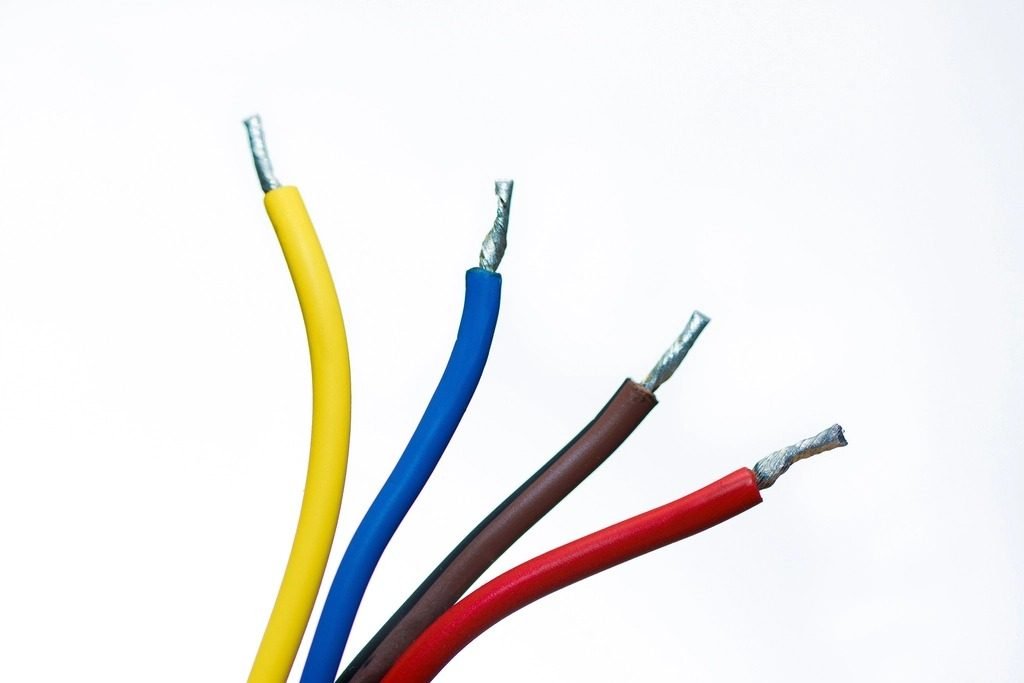 Color-coded electrical wires with stripped ends, ready to be installed