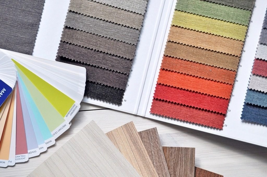 Wood, fabric and color samples laid out for comparing finishes