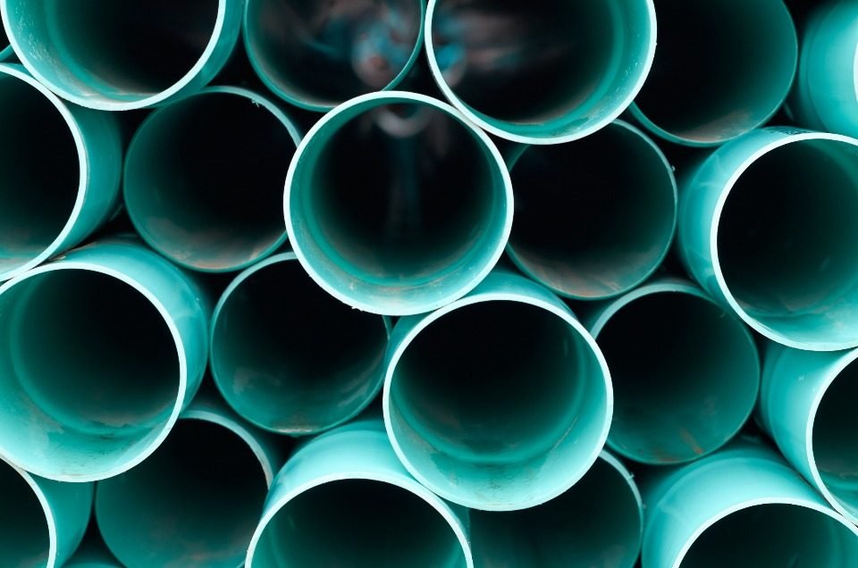 Stack of PVC pipes ready for a home plumbing installation