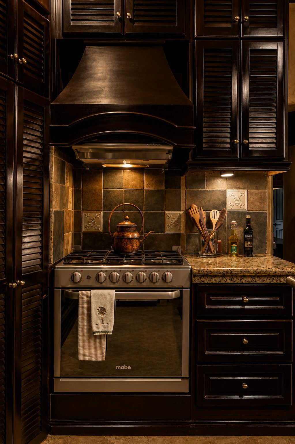 Kitchen cooking area with a stainless-steel stove, timber cabinets and a fitted extractor hood.